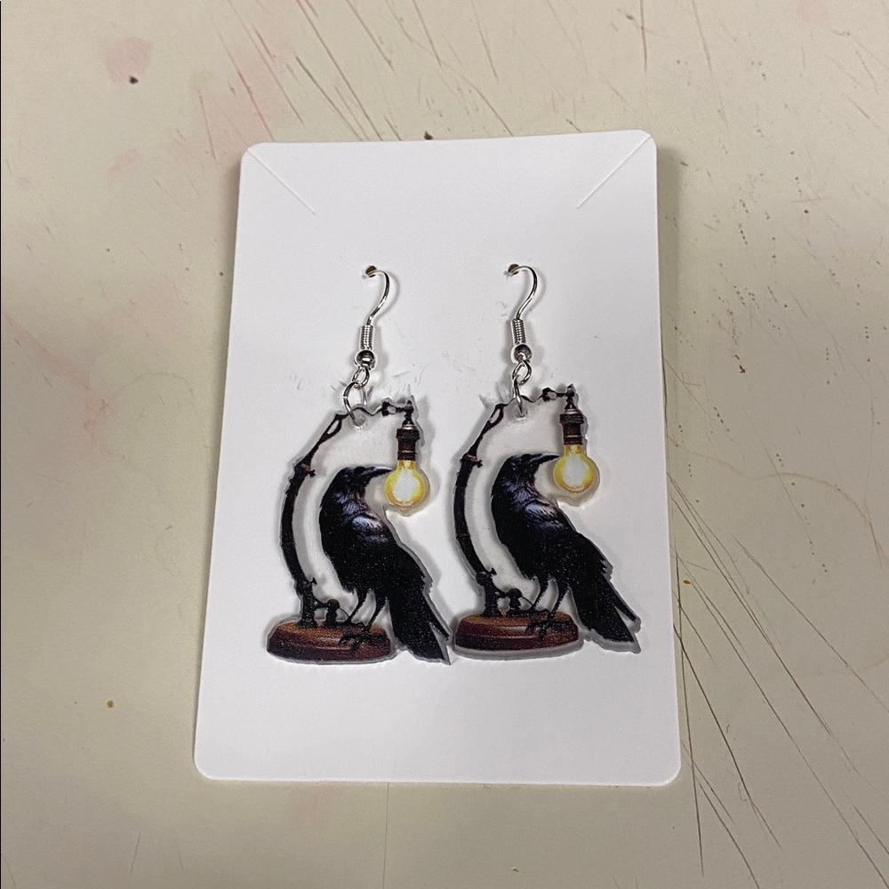 Raven Earrings with Light Bulb Design